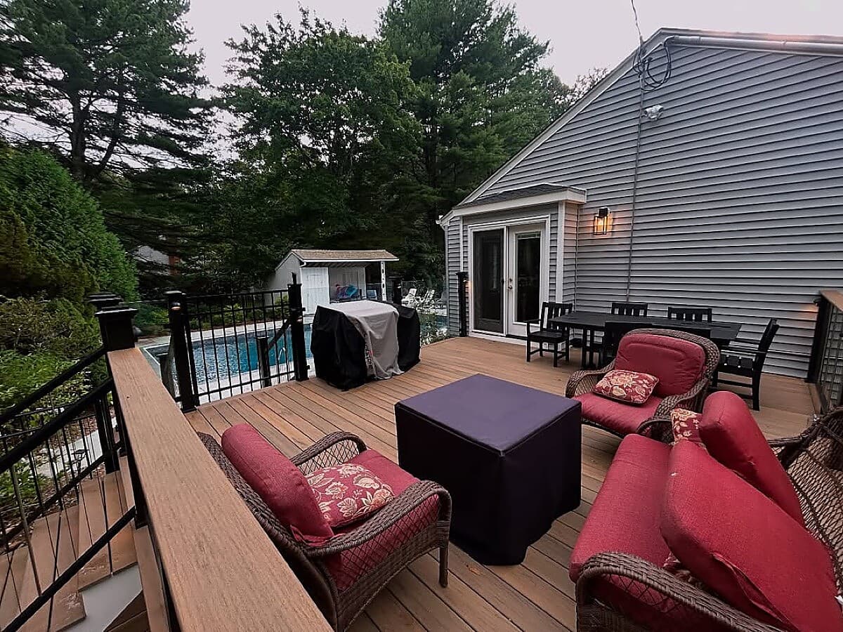 Multi-level composite deck with outdoor living space and pool view
