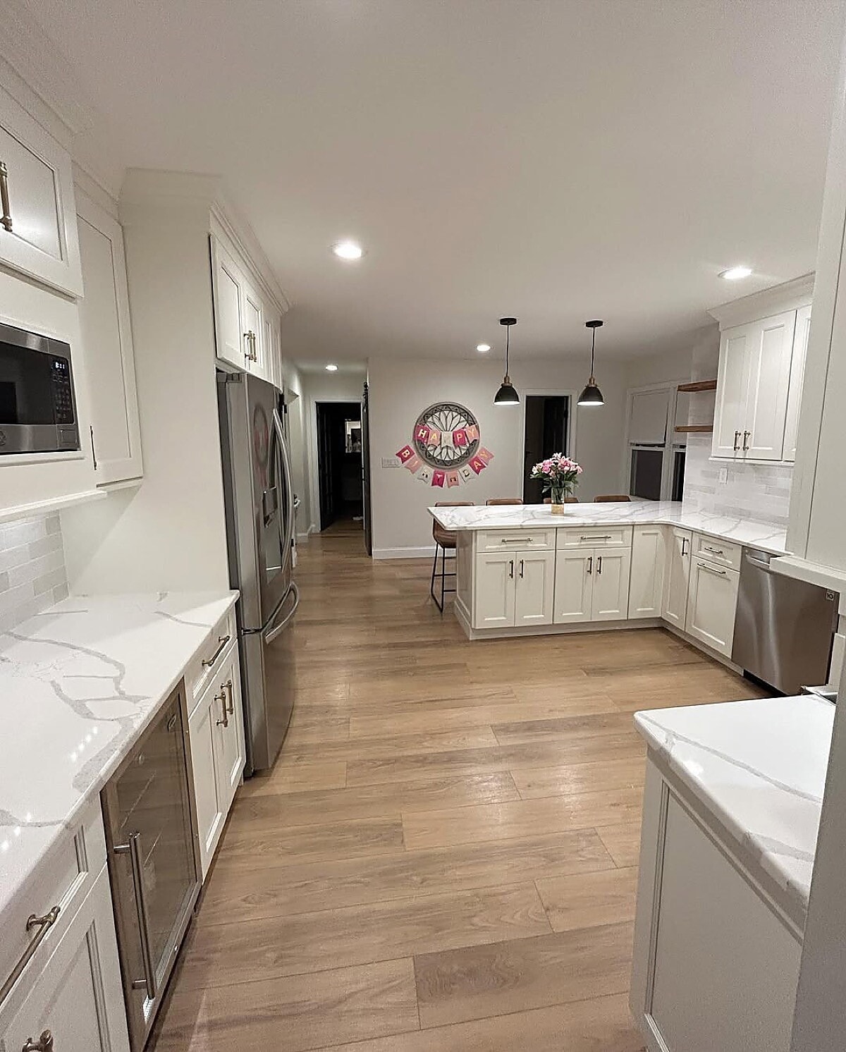 Gannon Remodeling open-concept kitchen remodel with island and pendant lights